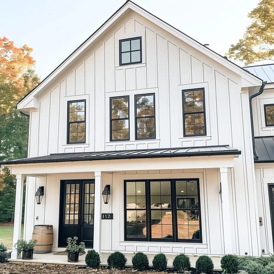 Bright white farmhouse with black doors and window frames